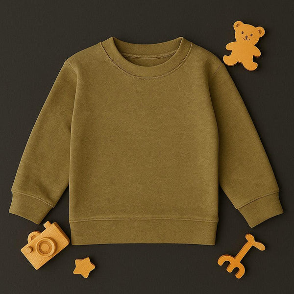 Autumn gold toddler sweatshirt laid flat with wooden toy camera, star, bear, and giraffe on dark background