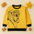 Yellow Funsies Garments kids sweatshirt featuring a black tiger graphic and black trim.
