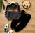 Gray hoodie with Bronx Boy text and black pants with orange drawstring on wooden floor, kids tracksuit outfit